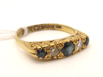 Lot 214 - An 18ct Gold Sapphire and Diamond Five Stone...