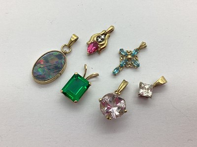 Lot 231 - Three 9ct Gold Stone Set Pendants, to include...