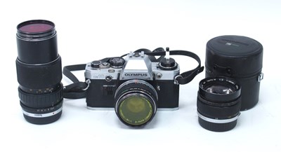 Lot 1322A - Olympus OM10 camera together with three...