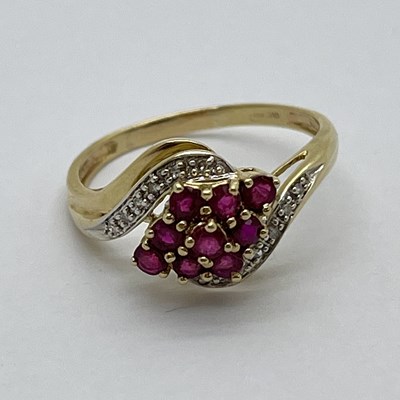 Lot 336 - A Diamond and Ruby Set Ring, of crossover...