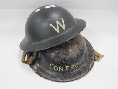 Lot 1398 - Black Tin Helmets, one painted 'W' the other...