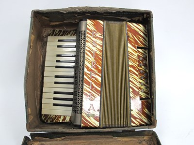 Lot 1335 - An Estrella Piano Accordion, with gold and...