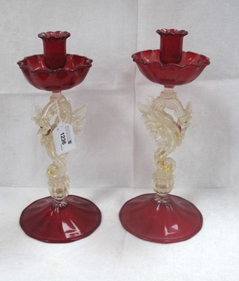 Lot 1236 - Pair of Italian Ruby Glass Candlesticks, each...