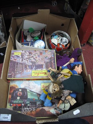 Lot 1044 - A quantity of vintage jigsaws, darts, puppets,...