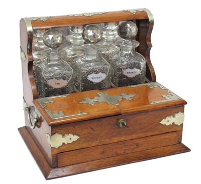 Lot 1287 - An Early XX Century Oak Cased Tantalus,...