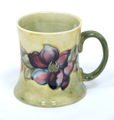 Lot 1155 - A Moorcroft Pottery Tankard, of waisted form...