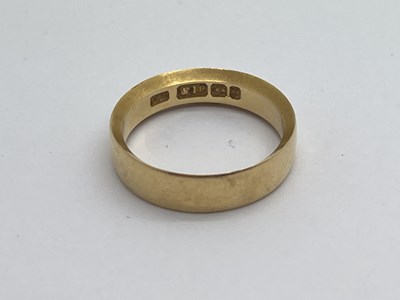 Lot 315 - An 18ct Gold Band, of plain design, brushed...