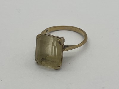 Lot 339 - A Single Stone Ring, octagon cut, to squared...