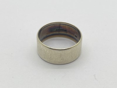 Lot 336 - A 9ct White Gold Plain Wedding Band, (finger...