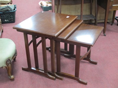 Lot 1557 - Mahogany nest of tables with crossbanded tops.