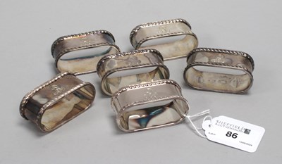 Lot 86 - A Set of Six Hallmarked Silver Napkin Rings,...