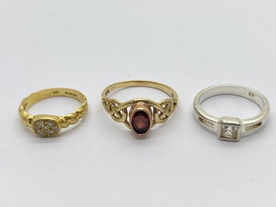 Lot 325 - An 18ct Gold Ring, of twist design with inset...