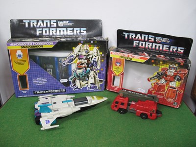 Lot 583 - Two Boxed Original Hasbro Transformers...