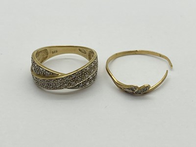 Lot 333 - A Diamond Set Crossover Ring, between tapered...