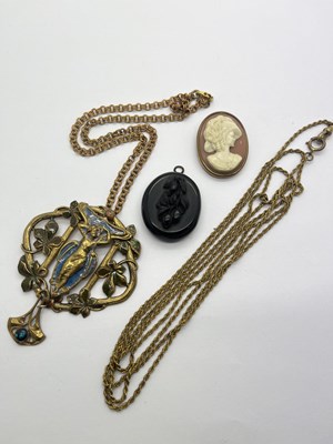 Lot 256 - A Jet Coloured Photo Locket, carved vine...