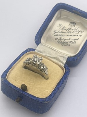 Lot 342 - A Three Stone Diamond Ring, illusion set with...