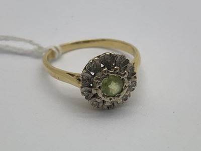 Lot 134 - A Stone Set Cluster Ring, the collet set...