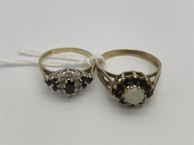 Lot 117 - A 9ct Gold Opal and Sapphire Set Cluster Ring,...