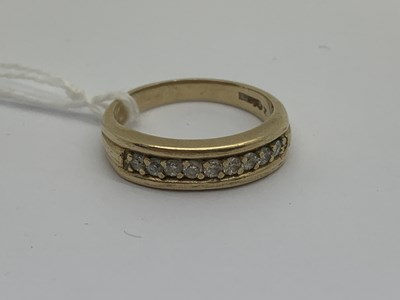 Lot 144 - A 9ct Gold Channel Claw Set Half Eternity...