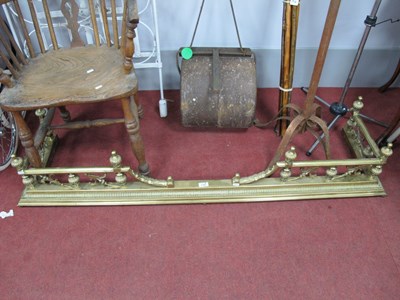 Lot 1158 - A large heavy brass fender with pierced...