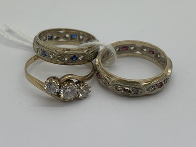 Lot 121 - A 9ct Gold Three Stone Ring, of crossover...