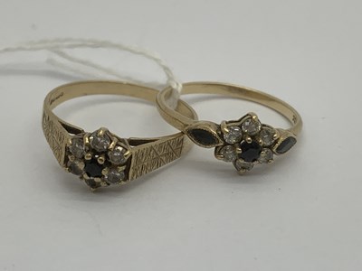 Lot 127 - A 9ct Gold Floral Cluster Ring, between...