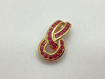 Lot 162 - A 9ct Gold Ruby Set Pendant, the invisible set...