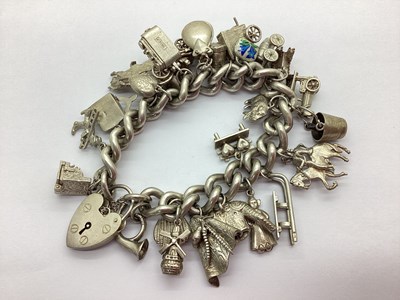 Lot 169 - A Solid Curb Link Charm Bracelet, to...