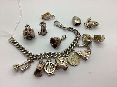 Lot 195 - A Curb Link Charm Bracelet, to swivel style...