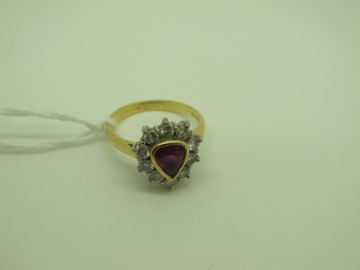 Lot 162 - An 18ct Gold Ruby and Diamond Cluster Ring,...