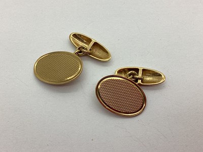 Lot 245 - A Pair of 9ct Gold Cufflinks, each oval panel...