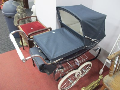 Lot 1160 - A vintage Silvercross pram in dark blue.