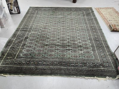 Lot 1614 - Pakistan Made Wool Tassled Carpet, with...