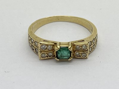 Lot 162 - A Modern Emerald and Diamond Set Dress Ring,...