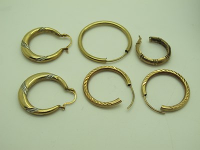 Lot 142 - A Pair of Modern Creole Hoop Earrings, (dents)...