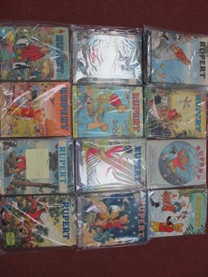 Lot 314 - Sixteen 1960's/1970's Rupert Annuals & Books...