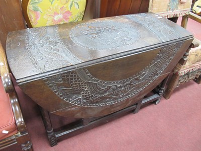 Lot 1603 - Dark Oak Drop Leaf Table, heavily carved with...