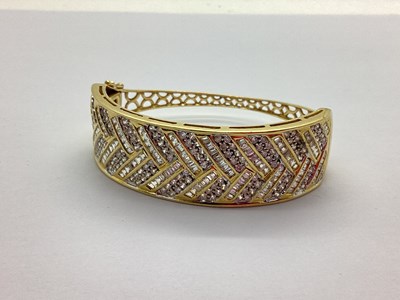 Lot 197 - A Modern Wide Front Hinged Bangle, channel and...