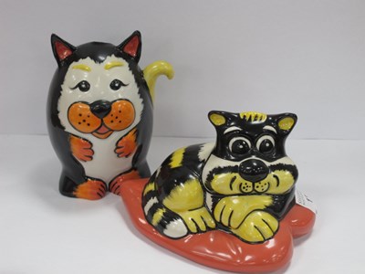 Lot 1334 - Lorna Bailey, yellow and black cat seated on a...