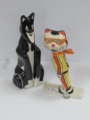 Lot 1262 - Lorna Bailey Ski Cat, 14.5 cm high, another in...