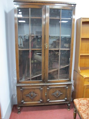 Lot 1621 - 1930s Oak Bookcase, with twin doors, over...