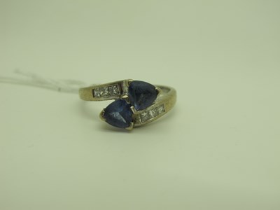 Lot 213 - A Modern Crossover Ring, (stones rubbed)...