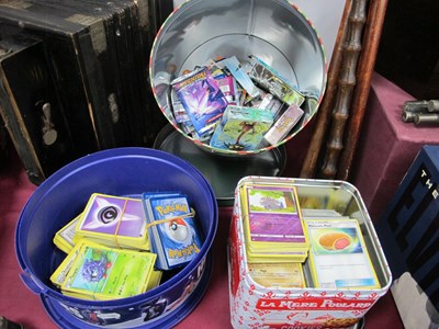 Lot 1399 - Modern Pokémon Trade Cards in Three Tins.