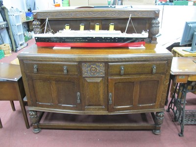 Lot 1594 - 1930s Oak Sideboard, back with cup-cover...