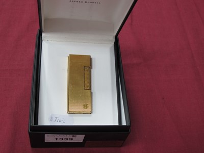 Lot 1339 - Dunhill; A Gilt Metal Cigarette Lighter, in...