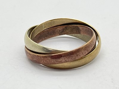 Lot 79 - A 9ct Tri-Colour Gold Triple Wedding Band,...