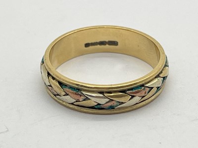 Lot 81 - A 9ct Gold Wedding Band, of weaved tri-colour...