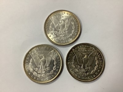 Lot 405 - Three USA Silver 'Morgan' Dollars, 1882, 1884...