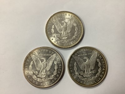 Lot 434 - Three USA Silver 'Morgan' Dollars, 1878, 1884...