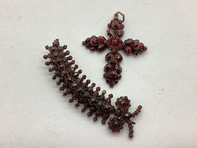 Lot 144 - A Faceted Garnet Set Cross Pendant, (one stone...